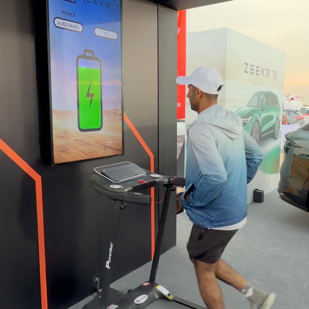 Interactive Treadmill Activation in Dubai: Participants generating human power to recharge EV cars